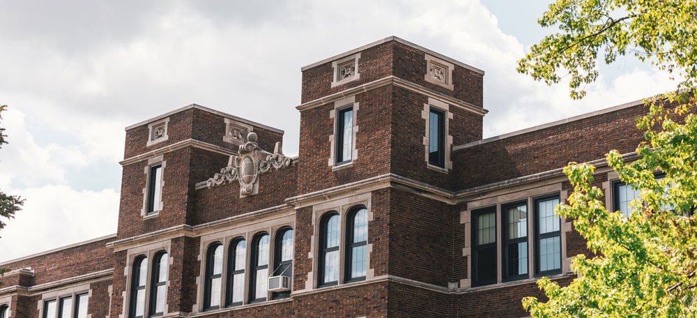 Old Main, brick building with arched windows.