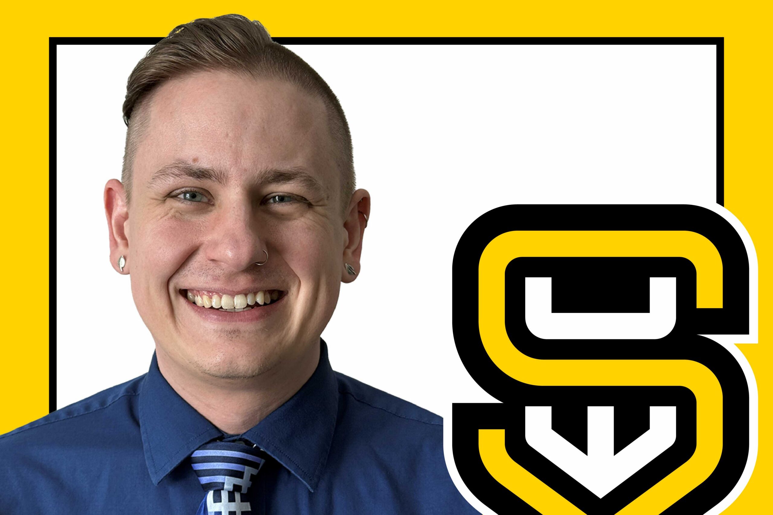 Smiling person with short hair and blue shirt next to a bold yellow and black letter S logo.