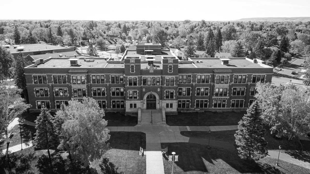 Old Main from above, surrounded by trees and sidewalks.