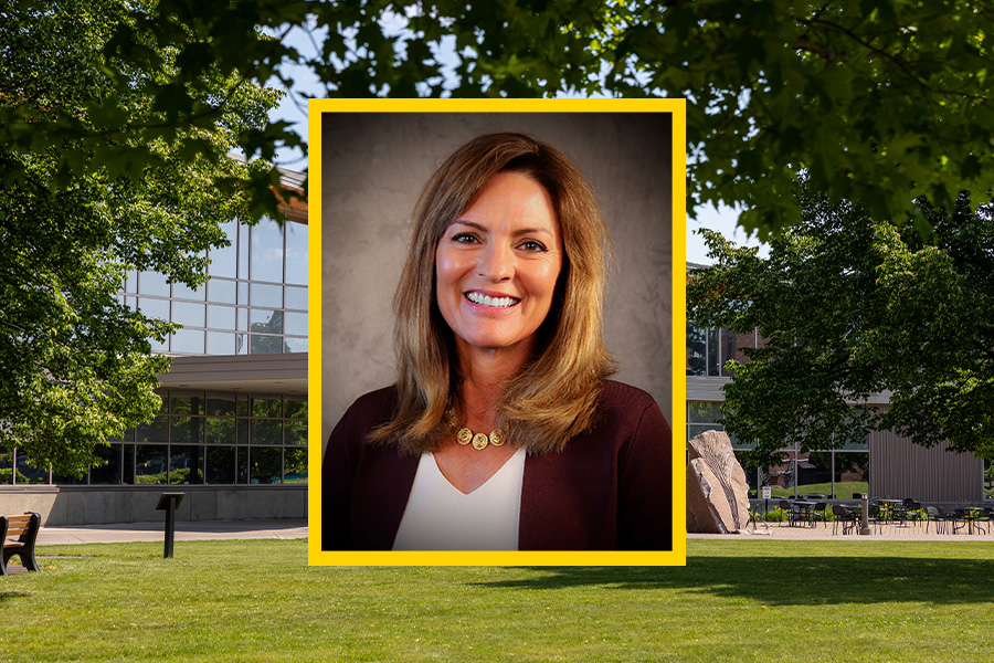 Portrait of a woman superimposed on a background of a modern building and green trees.