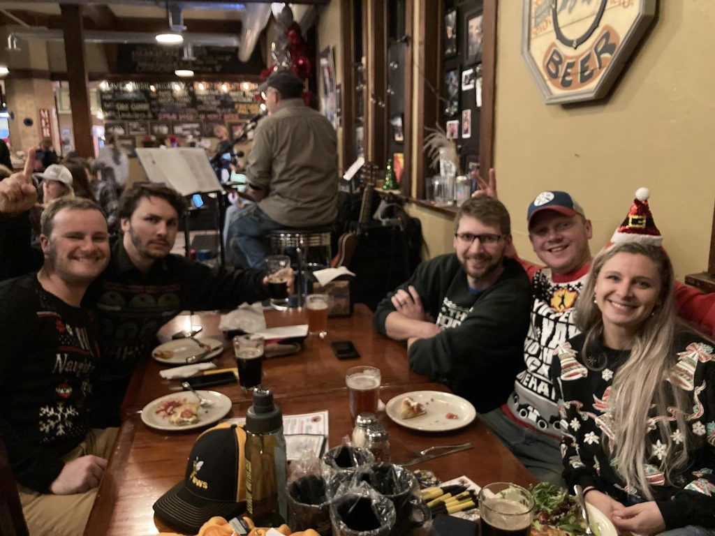 Alumni sitting at a table in a restaurant