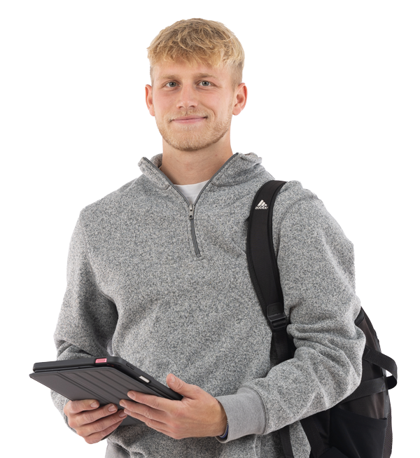 A young man with blond hair, wearing a gray zip-up sweater and a black backpack, holds a tablet—possibly exploring different majors and minors—and smiles at the camera against a plain white background.