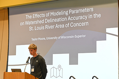 Taylor Moore presents his research at the St. Louis River Summitt.