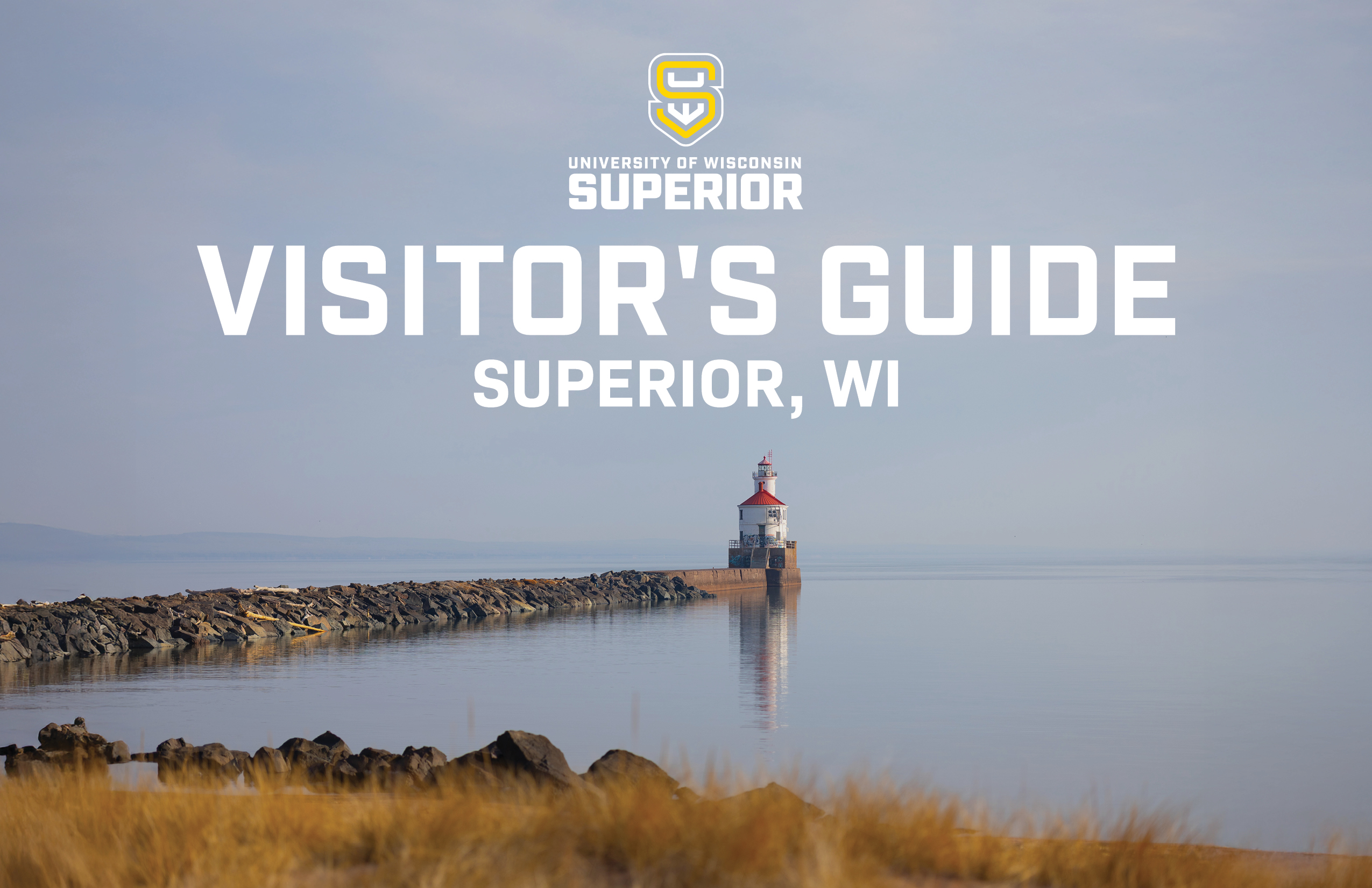 A calm lakeshore scene with a lighthouse on a pier, surrounded by water and golden grasses. Text reads: University of Wisconsin Superior. Visitors Guide. Superior, WI.